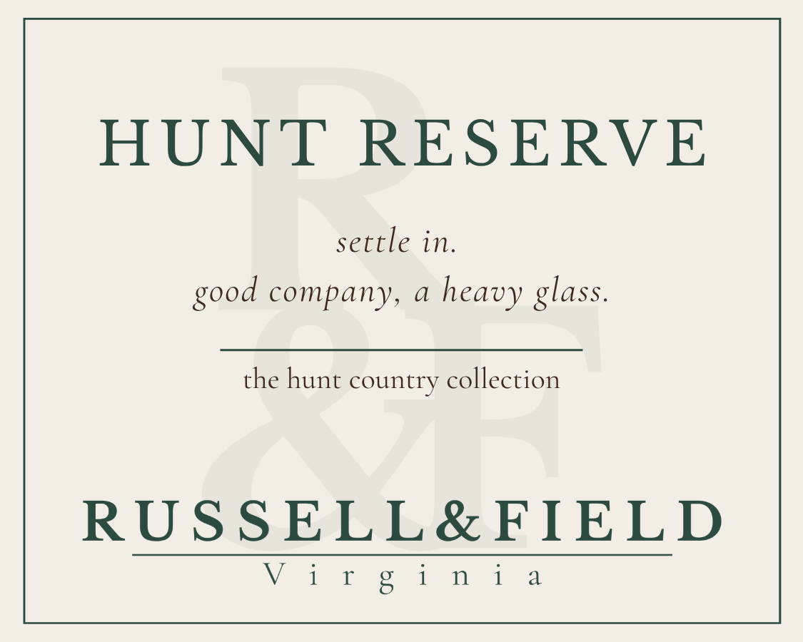 Hunt Reserve candle label for Russell & Field Virginia, featuring the text 'HUNT RESERVE' and the line "settle in. good company, a heavy glass."
