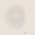 Antique White Ironstone Platter. An oval-shaped, translucent white ironstone platter with a scalloped rim, photographed from directly above on a matching off-white background. A 'Field Finds' logo is visible in the bottom right corner.