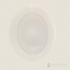Antique White Ironstone Platter. An oval-shaped, translucent white ironstone platter with a scalloped rim, photographed from directly above on a matching off-white background. A 'Field Finds' logo is visible in the bottom right corner.